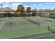 View of well-maintained community tennis courts with mountain views in the background at 5465 N 78Th St, Scottsdale, AZ 85250