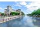 Beautiful waterfront view of building facades with lush greenery creating a tranquil outdoor space at 5465 N 78Th St, Scottsdale, AZ 85250