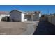 View of a spacious backyard with low maintenance landscaping featuring an extended covered patio at 6538 W Elwood St, Phoenix, AZ 85043