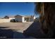 View of a spacious backyard with low maintenance landscaping featuring an extended covered patio at 6538 W Elwood St, Phoenix, AZ 85043