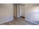 Neutral bedroom with hardwood flooring, closet and access to an ensuite bathroom at 6538 W Elwood St, Phoenix, AZ 85043