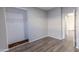 Bedroom with hardwood flooring and open closet space at 6538 W Elwood St, Phoenix, AZ 85043