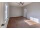 Bedroom with carpet flooring, large window, and a neutral color scheme at 6538 W Elwood St, Phoenix, AZ 85043