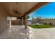 Inviting covered patio with ceiling fan, perfect for outdoor entertaining at 7164 W Paso Trl, Peoria, AZ 85383