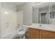 Bathroom featuring a shower over tub, vanity with solid surface top, and tile floors at 7164 W Paso Trl, Peoria, AZ 85383