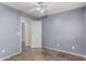 Bedroom showcasing neutral blue walls, tile floor, and a white ceiling fan at 7164 W Paso Trl, Peoria, AZ 85383