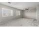 Spacious carpeted bedroom with neutral walls, white shutters, and a ceiling fan at 7164 W Paso Trl, Peoria, AZ 85383