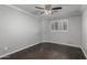 Bedroom featuring hardwood floors, a ceiling fan, and plantation shutters at 7164 W Paso Trl, Peoria, AZ 85383