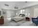 Stylized bedroom with carpet, ceiling fan, sliding glass doors to back yard, and accent furniture at 7164 W Paso Trl, Peoria, AZ 85383