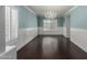 Bright dining room with hardwood floors, wainscoting, and a chandelier at 7164 W Paso Trl, Peoria, AZ 85383