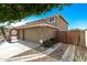 Side view of house with garage and gated walkway showing driveway and landscaping at 7164 W Paso Trl, Peoria, AZ 85383