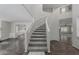 Elegant foyer with a curved staircase and wood and tile flooring at 7164 W Paso Trl, Peoria, AZ 85383