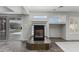Cozy living room fireplace with sliding glass doors and tile floor at 7164 W Paso Trl, Peoria, AZ 85383