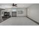 Spacious living area with a fireplace and large carpeted seating area at 7164 W Paso Trl, Peoria, AZ 85383