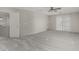 Spacious living room area with plush carpet and sliding door to the backyard at 7164 W Paso Trl, Peoria, AZ 85383