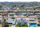Bird's eye view of home in residential neighborhood with green lawns and swimming pools at 7346 E Mckinley St, Scottsdale, AZ 85257