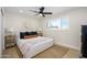 Relaxing bedroom features a comfy bed, neutral decor, and natural light from the window at 7346 E Mckinley St, Scottsdale, AZ 85257