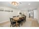 Bright dining room showcases an eight seat table and decorative lighting fixture at 7346 E Mckinley St, Scottsdale, AZ 85257