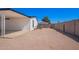 Spacious backyard with a covered patio and privacy wall perfect for outdoor living and entertaining at 7707 E Garnet Ave, Mesa, AZ 85209