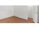 Bedroom with wood flooring, closet, and ample storage space at 7707 E Garnet Ave, Mesa, AZ 85209