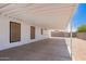 Covered patio area offering a spacious outdoor area and shade at 7707 E Garnet Ave, Mesa, AZ 85209