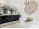 Elegant bathroom with a soaking tub, a chandelier, and a double vanity with modern fixtures and elegant decor at 7770 E Camelback Rd # 11, Scottsdale, AZ 85251