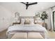 Bright and inviting bedroom featuring a tufted headboard, cozy bedding, and stylish bedside tables with lamps at 7770 E Camelback Rd # 11, Scottsdale, AZ 85251