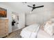 Spacious bedroom with walk-in closet featuring a view of a luxurious bathtub in the en-suite bathroom at 7770 E Camelback Rd # 11, Scottsdale, AZ 85251