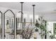Dining room chandelier with access to the gourmet kitchen in the background at 7770 E Camelback Rd # 11, Scottsdale, AZ 85251