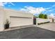 Charming single-Gathering home features a brick driveway, two-car garage, and mature landscaping at 7770 E Camelback Rd # 11, Scottsdale, AZ 85251