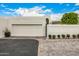 Charming single-Gathering home features a brick driveway, two-car garage, and mature landscaping at 7770 E Camelback Rd # 11, Scottsdale, AZ 85251