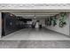 Spacious garage featuring black built in cabinets, bikes, and neutral colored walls and floor at 7770 E Camelback Rd # 11, Scottsdale, AZ 85251