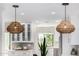 Two pendant lights hang above the kitchen island at 7770 E Camelback Rd # 11, Scottsdale, AZ 85251