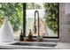 Modern kitchen sink with a view of the backyard at 7770 E Camelback Rd # 11, Scottsdale, AZ 85251