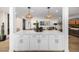 View of open concept kitchen and living area with bar seating at 7770 E Camelback Rd # 11, Scottsdale, AZ 85251