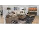 Relaxing living room with plush furniture, modern decor, and a large television at 7770 E Camelback Rd # 11, Scottsdale, AZ 85251