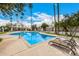Community pool surrounded by palm trees and lounge chairs at 7770 E Camelback Rd # 11, Scottsdale, AZ 85251