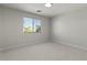 This bedroom has neutral walls, carpet flooring, and a window offering plenty of natural light at 9618 E Monterey Ave, Mesa, AZ 85209