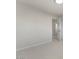 This bedroom features carpet flooring, neutral walls, and a doorway leading to another room at 9618 E Monterey Ave, Mesa, AZ 85209