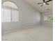 Bedroom with neutral-toned walls, vaulted ceilings, and large windows at 9618 E Monterey Ave, Mesa, AZ 85209