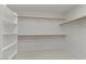 Bright walk-in closet with shelving and wooden rods at 9618 E Monterey Ave, Mesa, AZ 85209