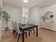 A formal dining room with a table, chairs, and sideboard, designed to create an inviting dining experience at 9618 E Monterey Ave, Mesa, AZ 85209