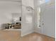 Bright and airy entryway featuring an open floor plan with hardwood floors and views into the living room at 9618 E Monterey Ave, Mesa, AZ 85209