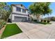 Charming home with a well-manicured lawn and mature trees adding to its curb appeal and a two car garage at 9618 E Monterey Ave, Mesa, AZ 85209