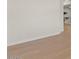 A bright hallway features hardwood floors and white baseboards at 9618 E Monterey Ave, Mesa, AZ 85209