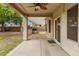A covered outdoor patio and built in grill offer an entertaining space in the backyard at 9665 E Nido Ave, Mesa, AZ 85209