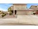 Charming two-story home with a three-car garage and well-maintained landscaping at 9665 E Nido Ave, Mesa, AZ 85209