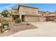 Charming two-story home with a three-car garage and well-maintained landscaping at 9665 E Nido Ave, Mesa, AZ 85209