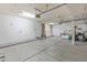 Spacious three-car garage with ample storage space and good lighting at 9665 E Nido Ave, Mesa, AZ 85209