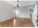 Spacious living room with tiled floors, neutral walls, and a stylish chandelier at 9665 E Nido Ave, Mesa, AZ 85209